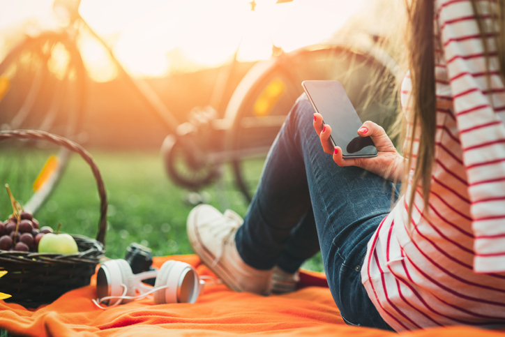 Girl holding her cell phone